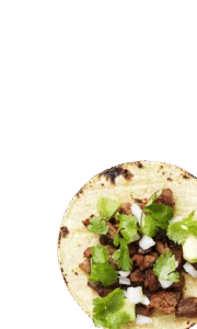 Street taco topped with grilled meat, chopped onion and cilantro on a corn tortilla