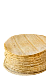 Stack of fresh corn tortillas made in-house at Doña Lupe Tortillería inside Del Sol IGA Mexican grocery stores